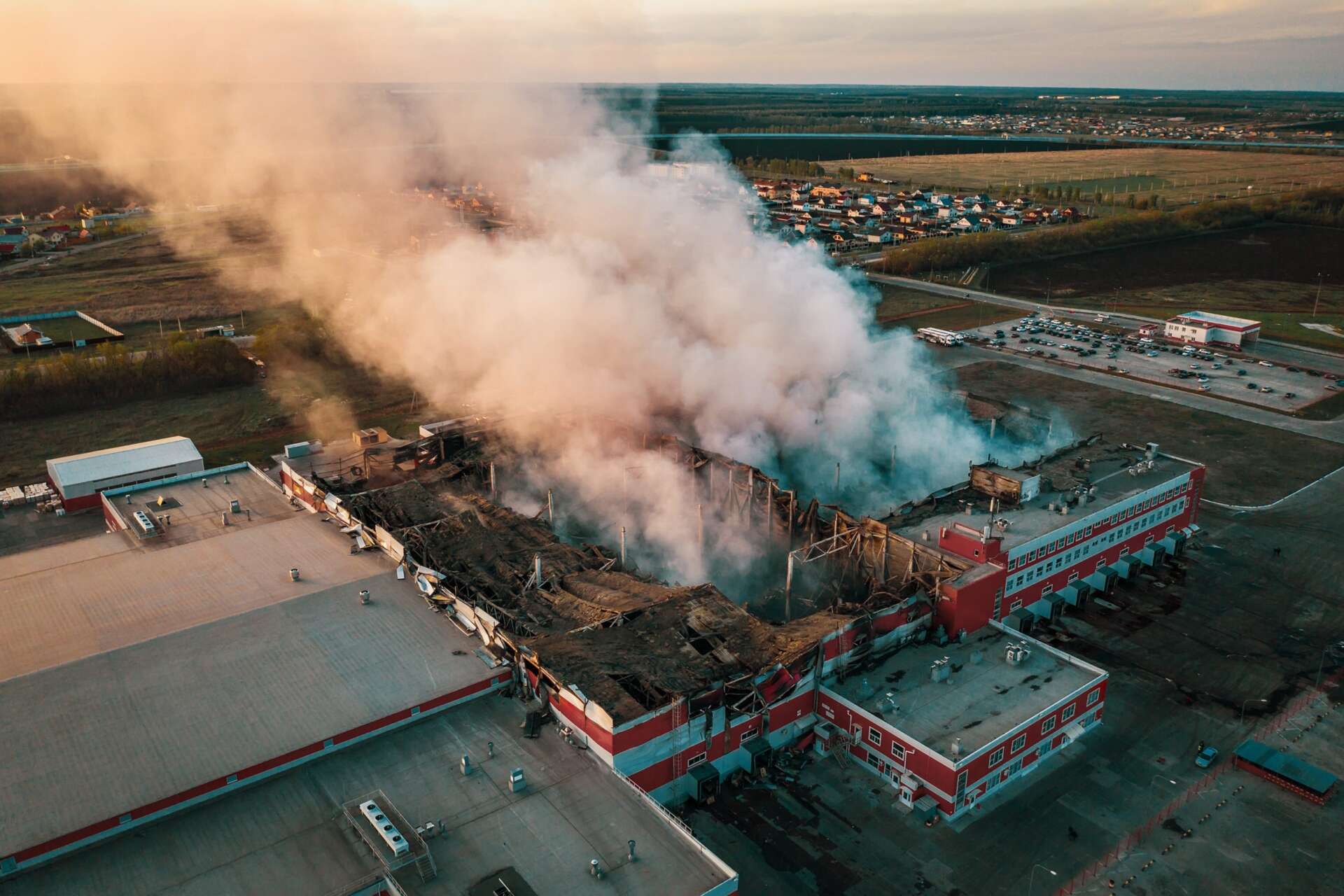 Aerial view of demolished burning industrial building by fire, huge ...